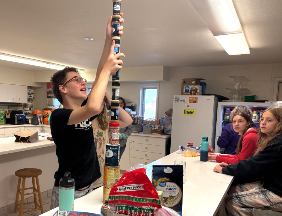 <p>Nels stacks spice canisters as the judges look on. He did not receive extra points (David Lepeska